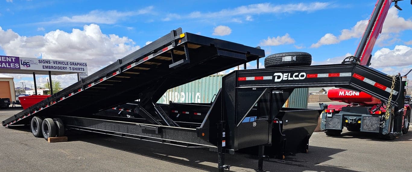 40' Hydraulic Tilt Deck Trailer Delco, With Removable Side Guides for Transporting Shipping Containers. Has Winch Mount on Front. 40' Hydraulic Tilt Deck Trailer Delco, With Removable Side Guides for Transporting Shipping Containers. Has Winch Mount on Front.