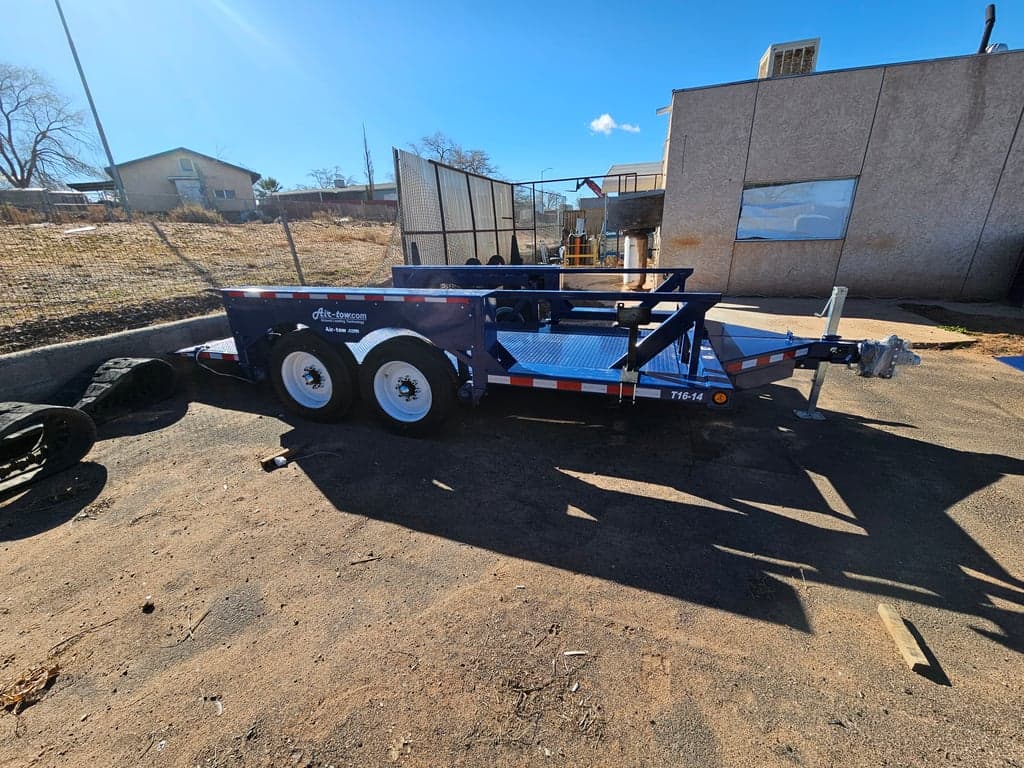 Air-Tow T16-14 14,000# capacity Deck Size 6'3" x 16' Tandem axles with Electric Brakes 17" wheels 16 ply tires